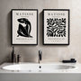 Set of 2 black abstract form posters arranged as gallery wall in minimalist interior