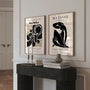 Set of 2 black abstract posters arranged as gallery wall in modern interior