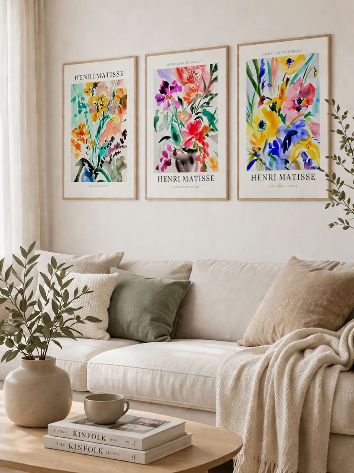 boho gallery wall with 3 framed henri matisse posters in neutral scandinavian living room with beige sofa and warm natural tones