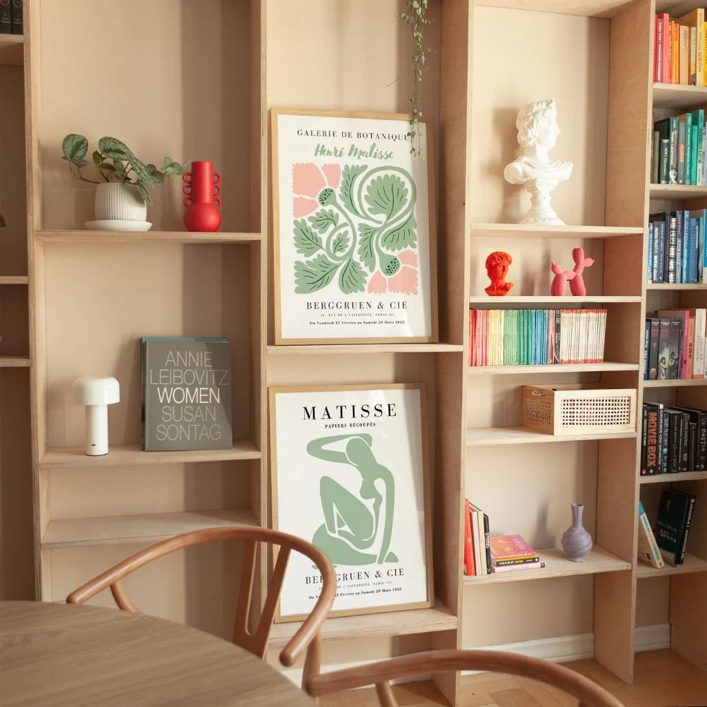 Set of 2 botanical green posters styled in modern living room with natural decor