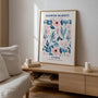 Close up of Paris blue flowers poster showing delicate watercolor petals in blue and pink