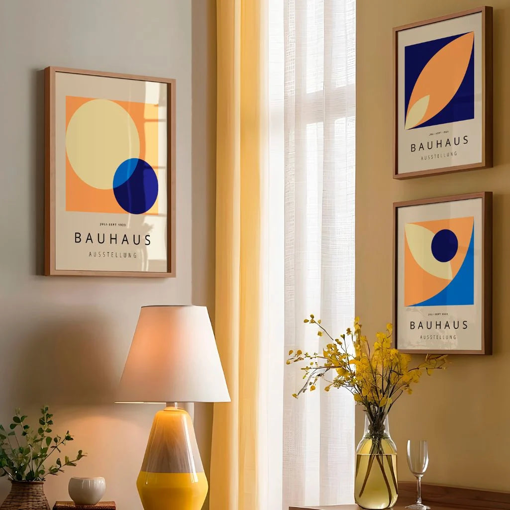 orange cream navy and light blue bauhaus poster set arranged in modern gallery wall