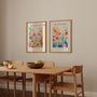 Set of 2 floral watercolor posters displayed as gallery wall in modern interior